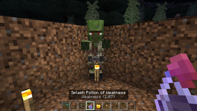 Using a Splash Potion of Weakness on a Zombie Villager in Minecraft