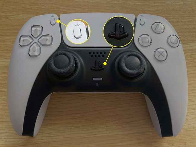 The PS button and Create button highlighted on a PS5 controller.