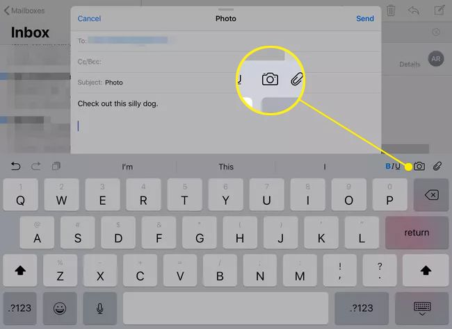 A mail message open on an iPad with the camera button highlighted