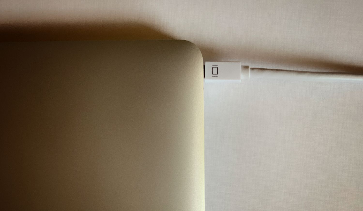 Mini DisplayPort-to-HDMI adapter attached to MacBookAir.